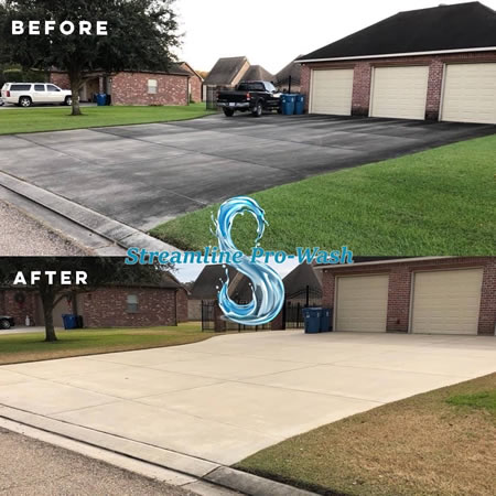Technician performing soft wash on a charlotte home exterior